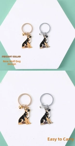 Close-up of German Shepherd dog keychains with gold and silver bells on display