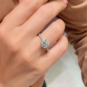 Classic four-prong round zircon engagement ring with micro-pave diamond band in white gold finish