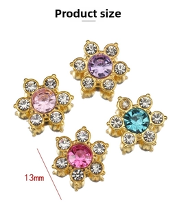 Macro shot of 13mm flower-shaped rhinestone buttons with gold finish in four colors