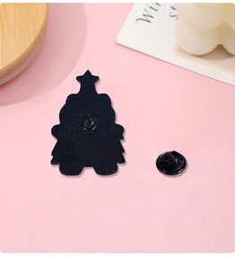 Detail view of the black metal enamel pin back with matte texture and butterfly clasp