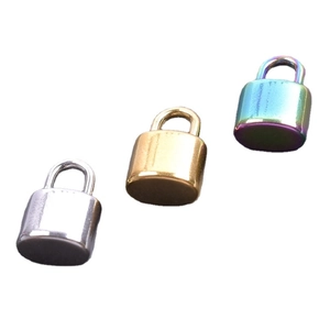 Three mini stainless steel locks in silver, gold and rainbow colors on white background
