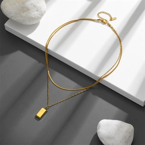 Double-layered gold titanium necklace with a snake chain and a GOLD bar pendant