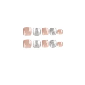 Press-on toenails in nude pink and silver glitter finish set against white background