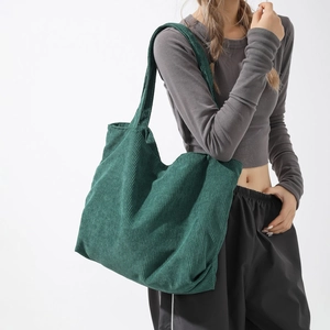 Forest green corduroy tote bag for women featuring a large capacity and minimalist design