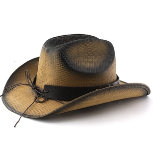 Detail view of woven straw cowboy hat with ombre gradient finish and decorative leather band
