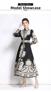Detailed view of paisley totem print and matching waist belt on a long-sleeve dress