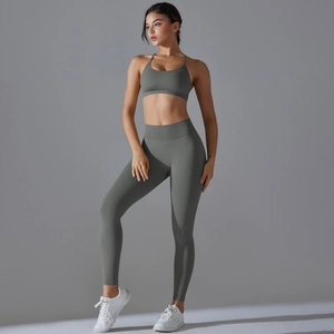 Detail of seamless yoga set showing high waist leggings and thin strap sports bra