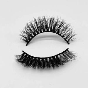 Close-up of fluffy black false eyelashes with layered fibers for a natural voluminous look