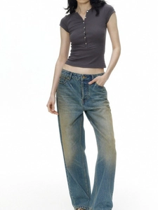 Slim fit dark grey henley T-shirt paired with vintage wash blue denim jeans for women