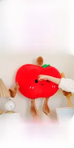 Detailed view of the cute red apple plush toy showing its soft texture and rebound effect