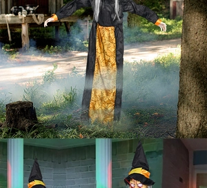 Detail of life-size hanging Halloween witch prop with glowing eyes and tattered robe