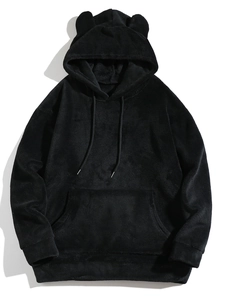 Detail of black hooded sweatshirt featuring coral fleece texture and cute bear ears
