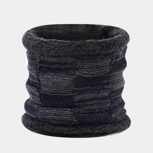 Detail of winter neck warmer with navy plaid knit and soft black fleece lining
