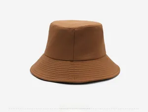 Detail view of the side profile and multi-row stitching on the brown cotton bucket hat