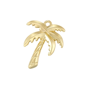 Macro view of a gold coconut tree pendant with top ring detail for jewelry making