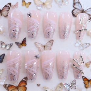 Pink long ballet press-on nails with silver glitter, 3D butterfly, and pearl accents