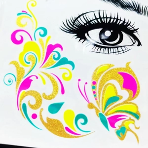 Neon floral and butterfly temporary eye tattoo with gold glitter for music festivals