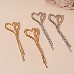 Chic oversized heart fringe earrings with rhinestones in gold and silver finishes