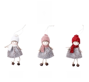 Detailed view of handmade Christmas girl dolls with plush dresses and tiny wooden bells
