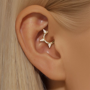 Close-up of gold cartilage hoop with marquise opal and round zircon fan design