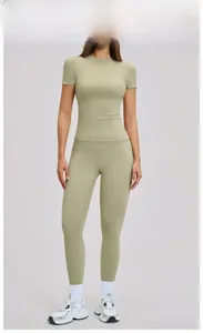 Detail view of the moss green high-waisted seamless leggings and round neck sport top set