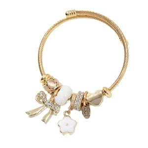 Gold stainless steel twisted wire bangle with crystal bow flower and heart charms