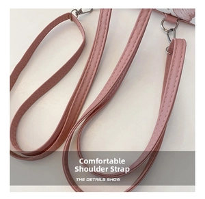 Detail of pink PU leather detachable shoulder strap with silver metal swivel hook