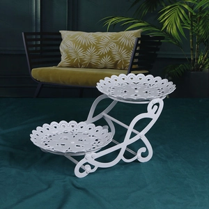 Elegant white metal 2-tier fruit stand with intricate hollow patterns for home decor