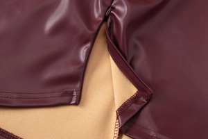 Detail of burgundy PU leather top featuring invisible zipper and warm fleece lining