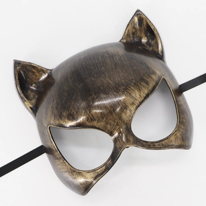 Detailed view of bronze catwoman mask with vintage metallic texture and elastic band