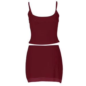 Detail of burgundy two-piece set featuring a rhinestone camisole and slim-fit mini skirt