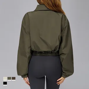 Deep olive green cropped windproof sports jacket for women with elastic hem and cuffs