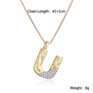 Detail view of U-shaped letter pendant with zircon inlay and 45cm chain length