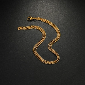 Elegant S-curved golden titanium steel curb chain necklace with lobster clasp on dark texture