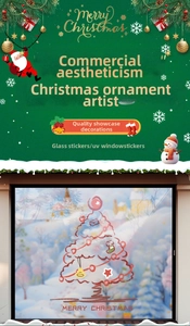 Detail of red hand-drawn Christmas tree window stickers with Merry Christmas text