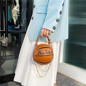Fashionable basketball shaped crossbody bag in orange leather with gold chain strap