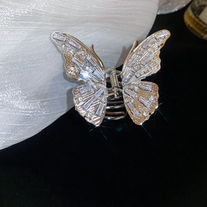 Detailed macro view of the silver butterfly hair claw clip with inlaid sparkling zircons