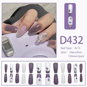 Detail of lilac purple long trapezoid press-on nails with star patterns and rhinestones