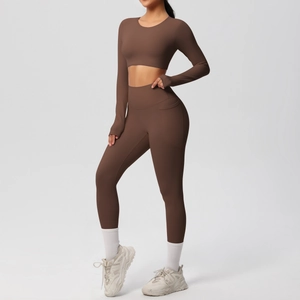 Detail view of yoga set featuring side phone pocket and sleeve thumbhole design