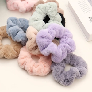 Soft plush scrunchies in pastel colors for women with warm fluffy texture