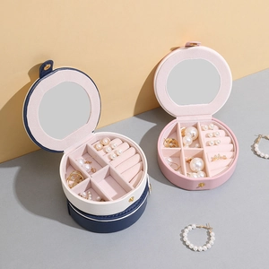 Boîte à bijoux ronde portable en cuir PU avec miroir intégré et compartiments