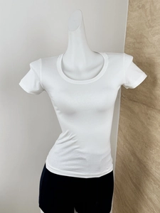 Detailed view of white slim fit crew neck T-shirt on mannequin with soft cotton texture