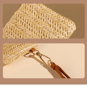 Detailed herringbone weave texture on straw coin purse with golden clasp and brown strap