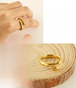 Detail of 18k gold plated stainless steel hug ring showing lead and nickel free texture