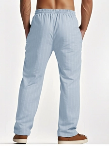Rear view of light blue striped linen trousers showing waist detail and straight fit