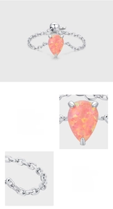 Macro detail of teardrop pink opal stone and S925 sterling silver adjustable chain ring