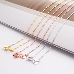 Detailed close-up of S925 sterling silver necklaces in gold, rose gold and silver finishes