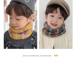 Detail view of children's plaid knit neck warmer scarves in yellow and brown-blue patterns
