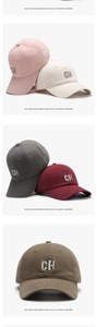 Detail of multi-color baseball caps featuring 3D CH letter embroidery and cotton twill texture