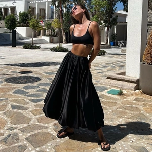 Chic black halter crop top and silky midi A-line skirt set for summer street style